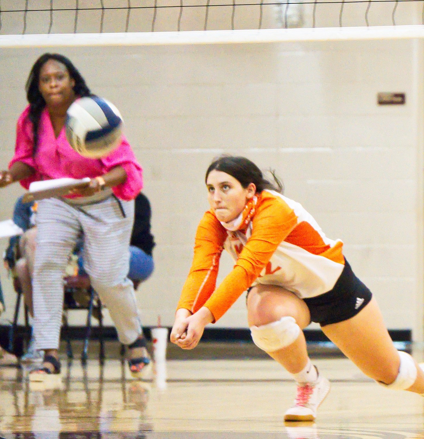 Brittany Pickle digs one out under the ever-watchful eye of coach TaShara Stephens.
